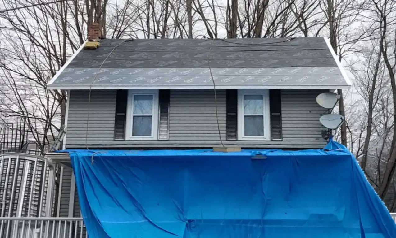 Installing Shingles With Tarp Cleanup
